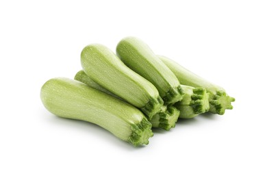 Photo of Many fresh ripe zucchinis isolated on white