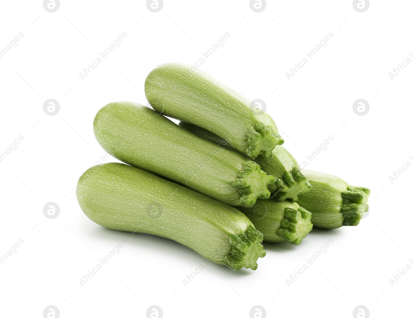 Many fresh ripe zucchinis isolated on white Photo of Many fresh ripe zucchinis isolated on white