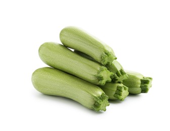 Photo of Many fresh ripe zucchinis isolated on white