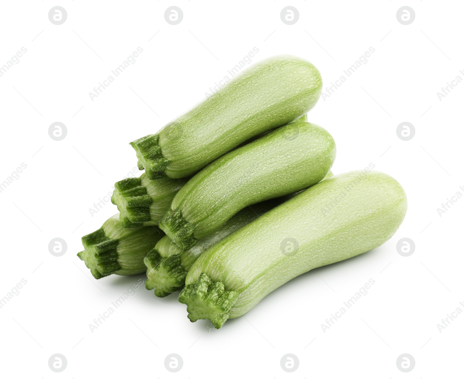 Many fresh ripe zucchinis isolated on white Photo of Many fresh ripe zucchinis isolated on white