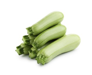 Photo of Many fresh ripe zucchinis isolated on white