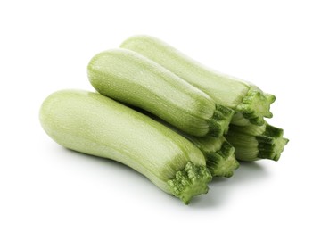 Photo of Many fresh ripe zucchinis isolated on white