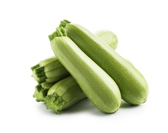 Photo of Many fresh ripe zucchinis isolated on white