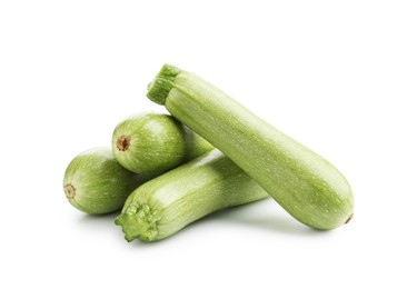 Photo of Many fresh ripe zucchinis isolated on white