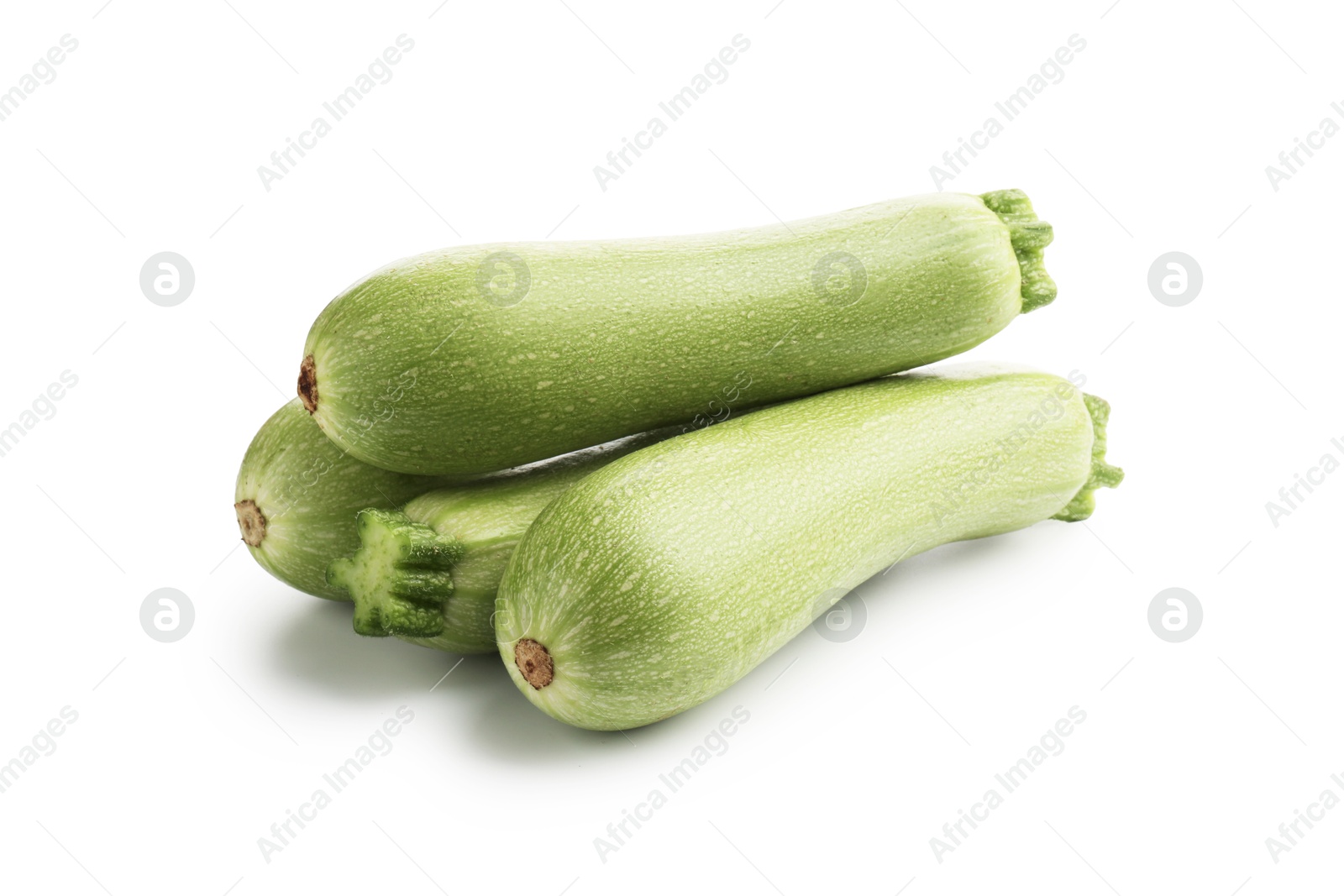 Many fresh ripe zucchinis isolated on white Photo of Many fresh ripe zucchinis isolated on white