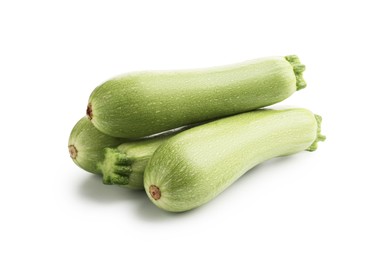 Photo of Many fresh ripe zucchinis isolated on white