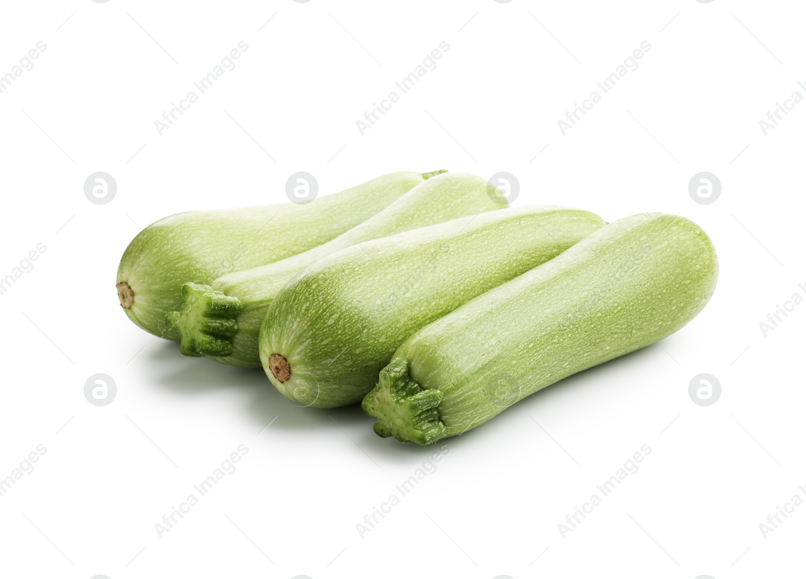 Many fresh ripe zucchinis isolated on white Photo of Many fresh ripe zucchinis isolated on white
