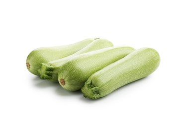 Photo of Many fresh ripe zucchinis isolated on white