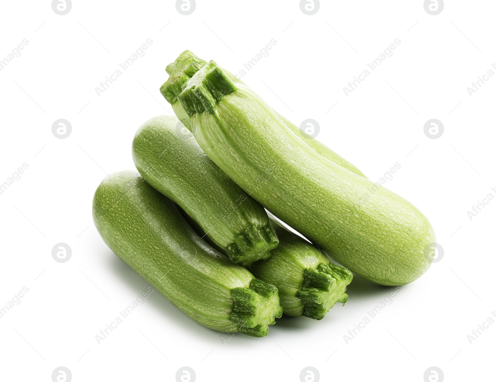 Many fresh ripe zucchinis isolated on white Photo of Many fresh ripe zucchinis isolated on white