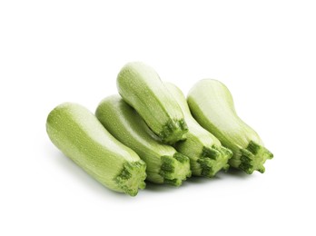 Photo of Many fresh ripe zucchinis isolated on white