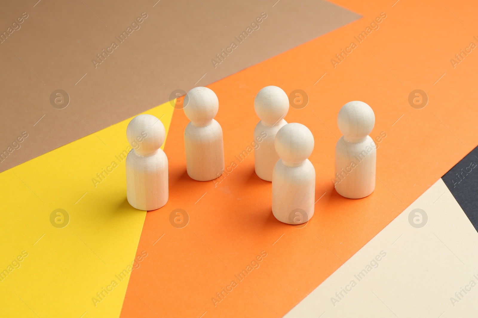 Tolerance concept. Human figures on colorful background, closeup Photo of Tolerance concept. Human figures on colorful background, closeup