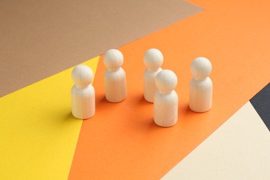 Photo of Tolerance concept. Human figures on colorful background, closeup