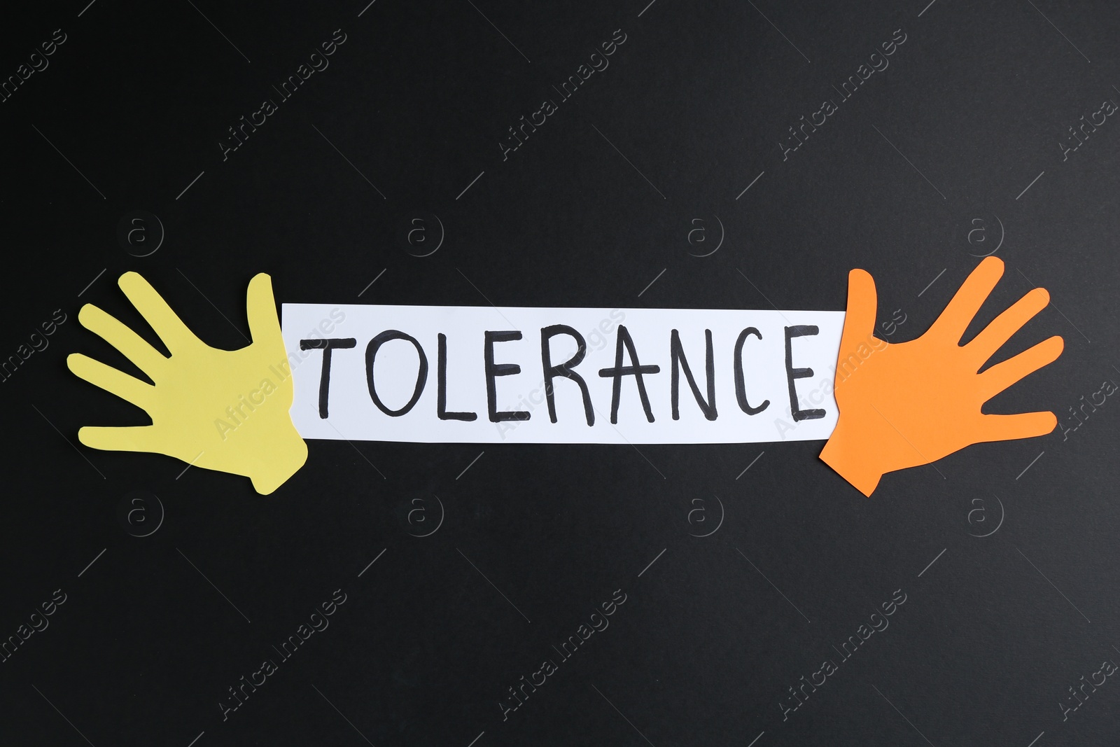 Card with word Tolerance and colorful paper hands on black background, flat lay Photo of Card with word Tolerance and colorful paper hands on black background, flat lay