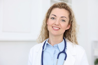 Photo of Portrait of professional pediatrician with stethoscope in hospital