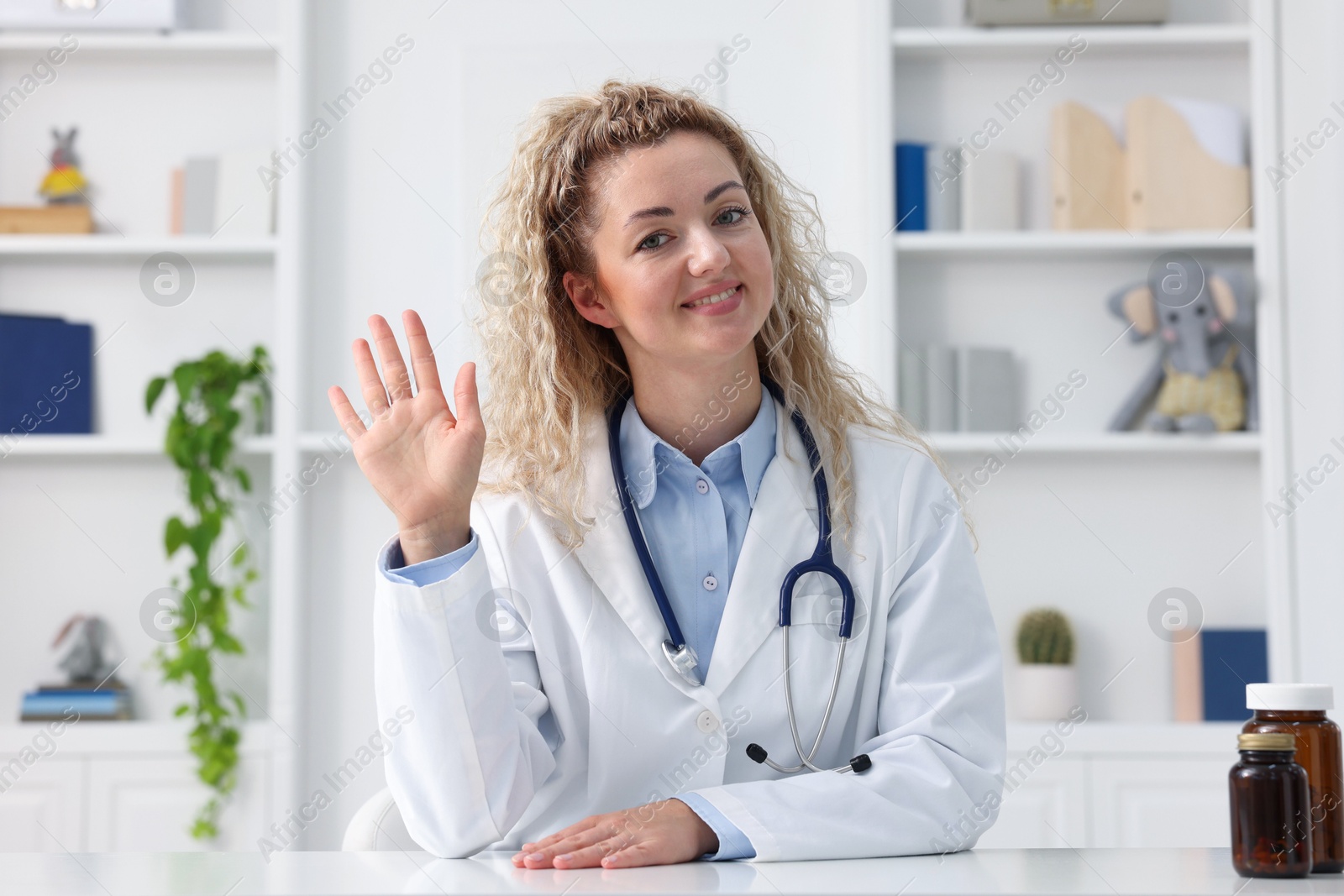 Pediatrician having video call with patient, view from camera Photo of Pediatrician having video call with patient, view from camera