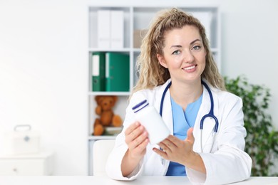 Photo of Pediatrician recommending pills during video call with patient, view from camera. Space for text