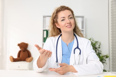 Photo of Pediatrician having video call with patient, view from camera