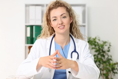 Photo of Pediatrician having video call with patient, view from camera