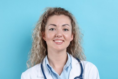 Photo of Portrait of pediatrician on light blue background