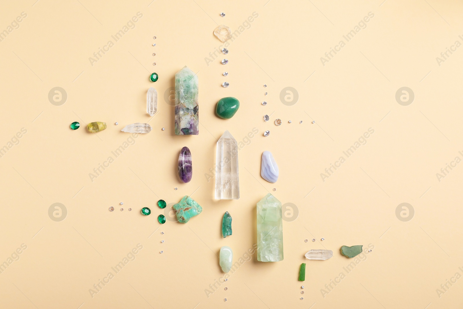 Different gemstones on beige background, flat lay Photo of Different gemstones on beige background, flat lay