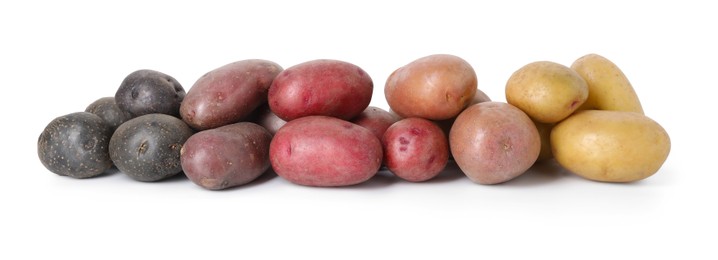 Photo of Different types of potatoes isolated on white