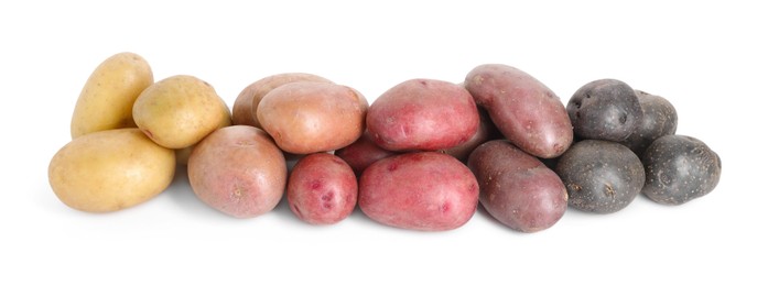 Photo of Different types of potatoes isolated on white