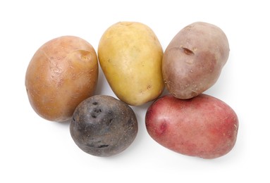 Photo of Different types of potatoes isolated on white, top view