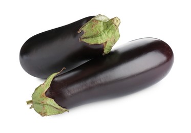 Photo of Fresh raw ripe eggplants isolated on white