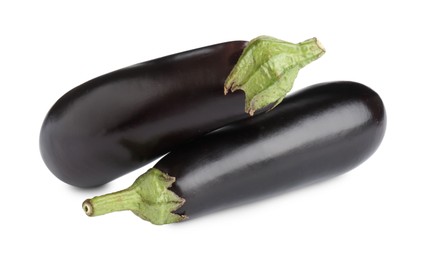 Photo of Fresh raw ripe eggplants isolated on white
