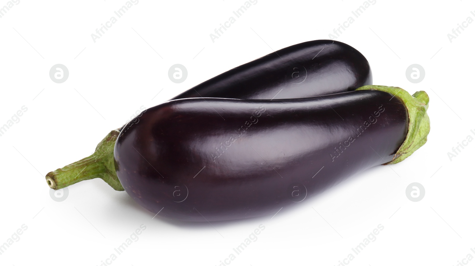 Photo of Fresh raw ripe eggplants isolated on white