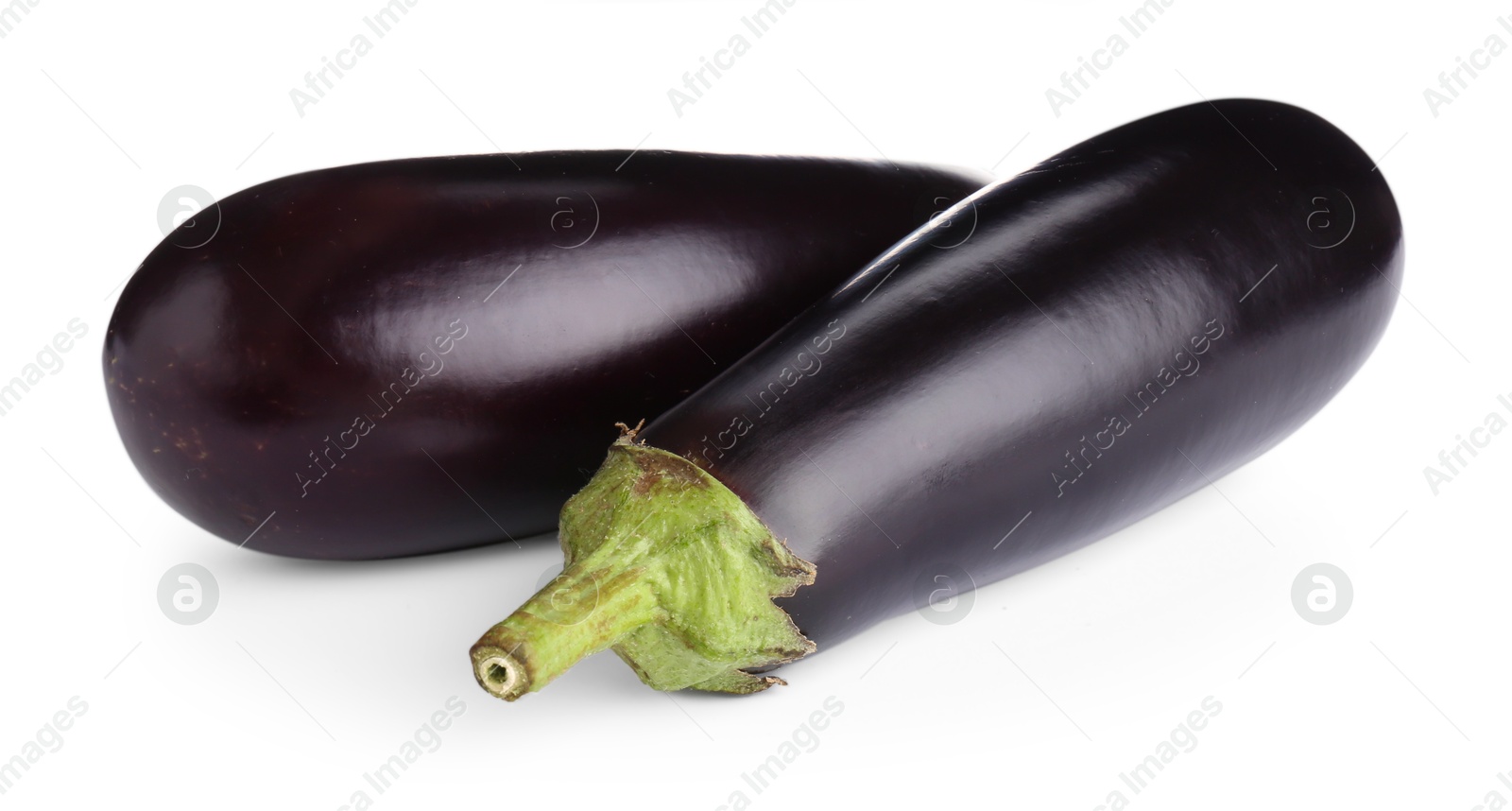 Photo of Fresh raw ripe eggplants isolated on white