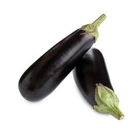 Photo of Fresh raw ripe eggplants isolated on white