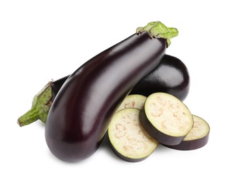 Photo of Whole and cut fresh eggplants isolated on white