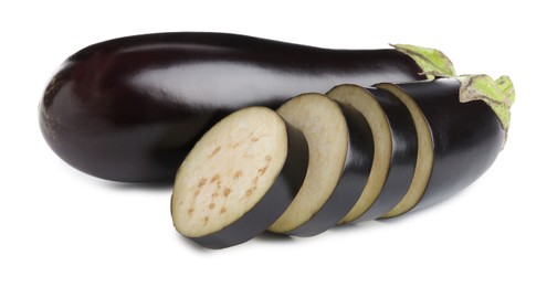 Photo of Whole and cut fresh eggplants isolated on white