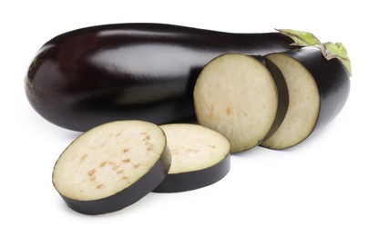 Photo of Whole and cut fresh eggplants isolated on white