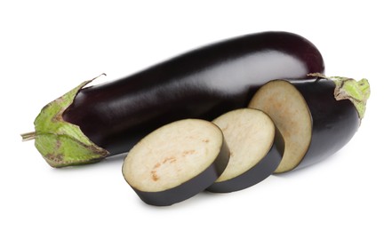 Photo of Whole and cut fresh eggplants isolated on white