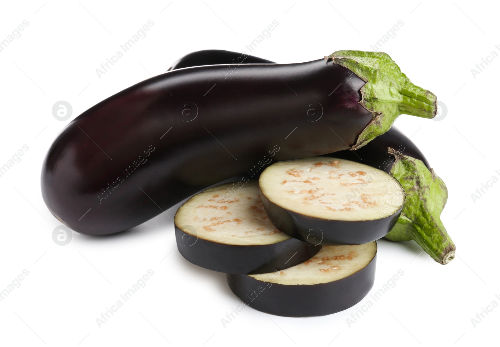 Photo of Whole and cut fresh eggplants isolated on white