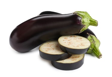 Photo of Whole and cut fresh eggplants isolated on white