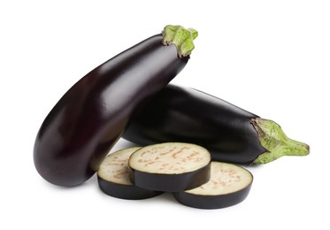 Photo of Whole and cut fresh eggplants isolated on white