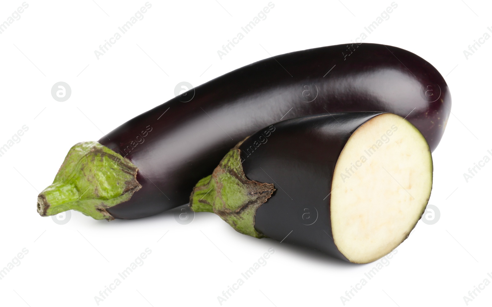Photo of Whole and cut fresh eggplants isolated on white