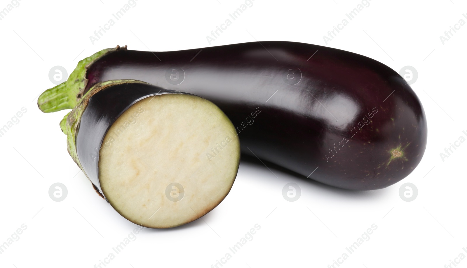 Photo of Whole and cut fresh eggplants isolated on white