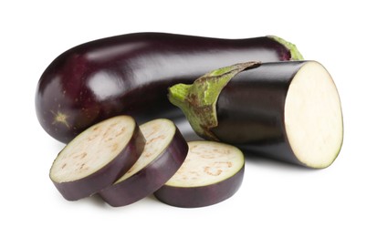 Photo of Whole and cut fresh eggplants isolated on white