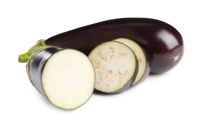 Photo of Whole and cut fresh eggplants isolated on white