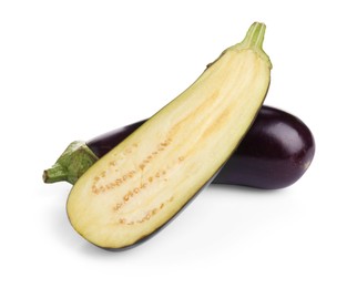 Photo of Whole and cut fresh eggplants isolated on white