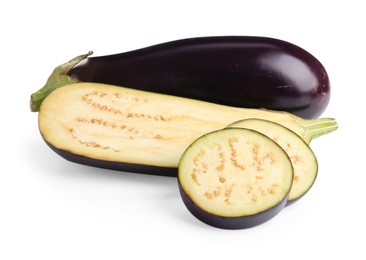 Photo of Whole and cut fresh eggplants isolated on white