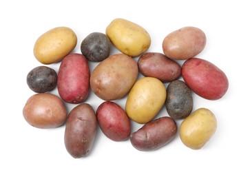Photo of Different types of potatoes isolated on white, top view