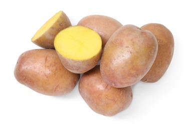 Photo of Whole and cut fresh potatoes isolated on white, top view