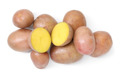 Photo of Whole and cut fresh potatoes isolated on white, top view
