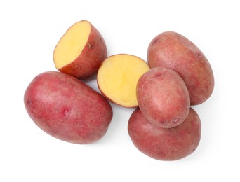 Photo of Whole and cut fresh red potatoes isolated on white, top view