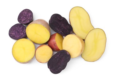 Photo of Different types of potatoes isolated on white, top view